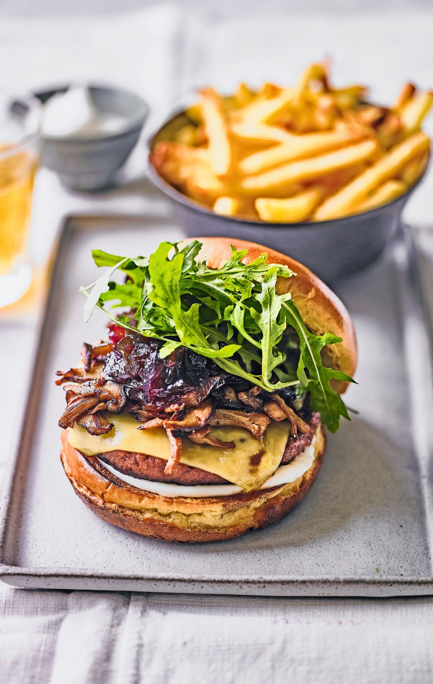 Caramelised onion, mushroom & cheese-loaded vegan burger