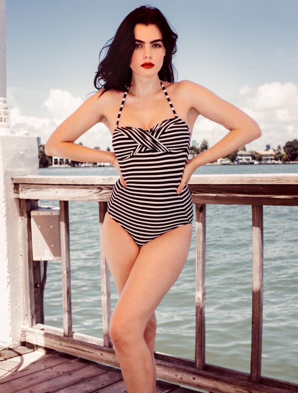 Charli Howard in a striped swimsuit