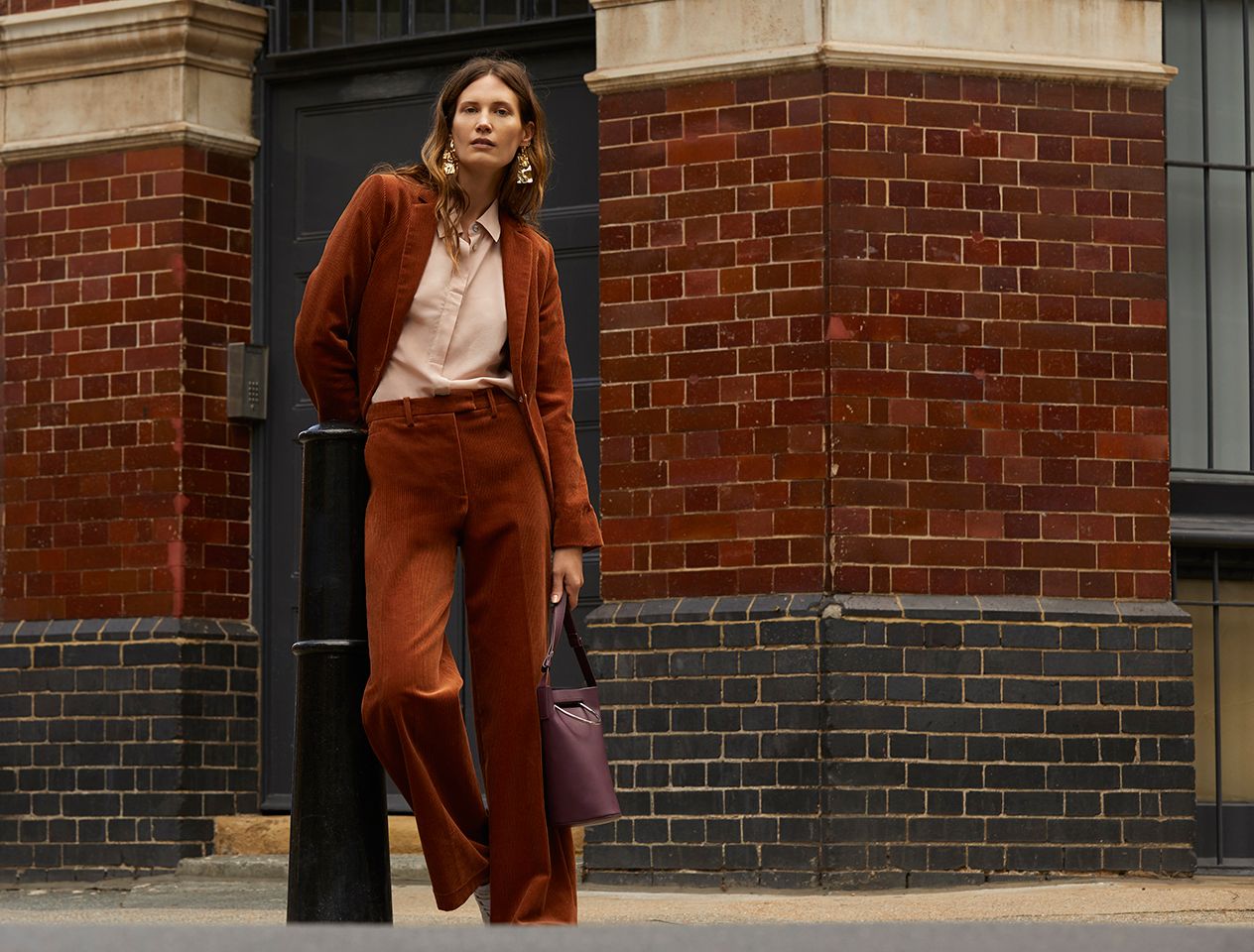Model in a cord trouser suit