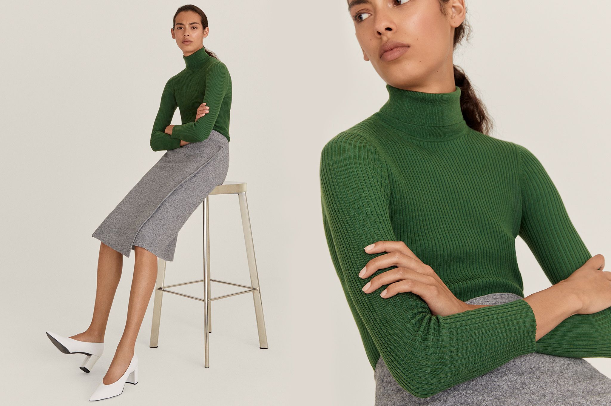Model wearing green roll-neck, grey skirt and white shoes