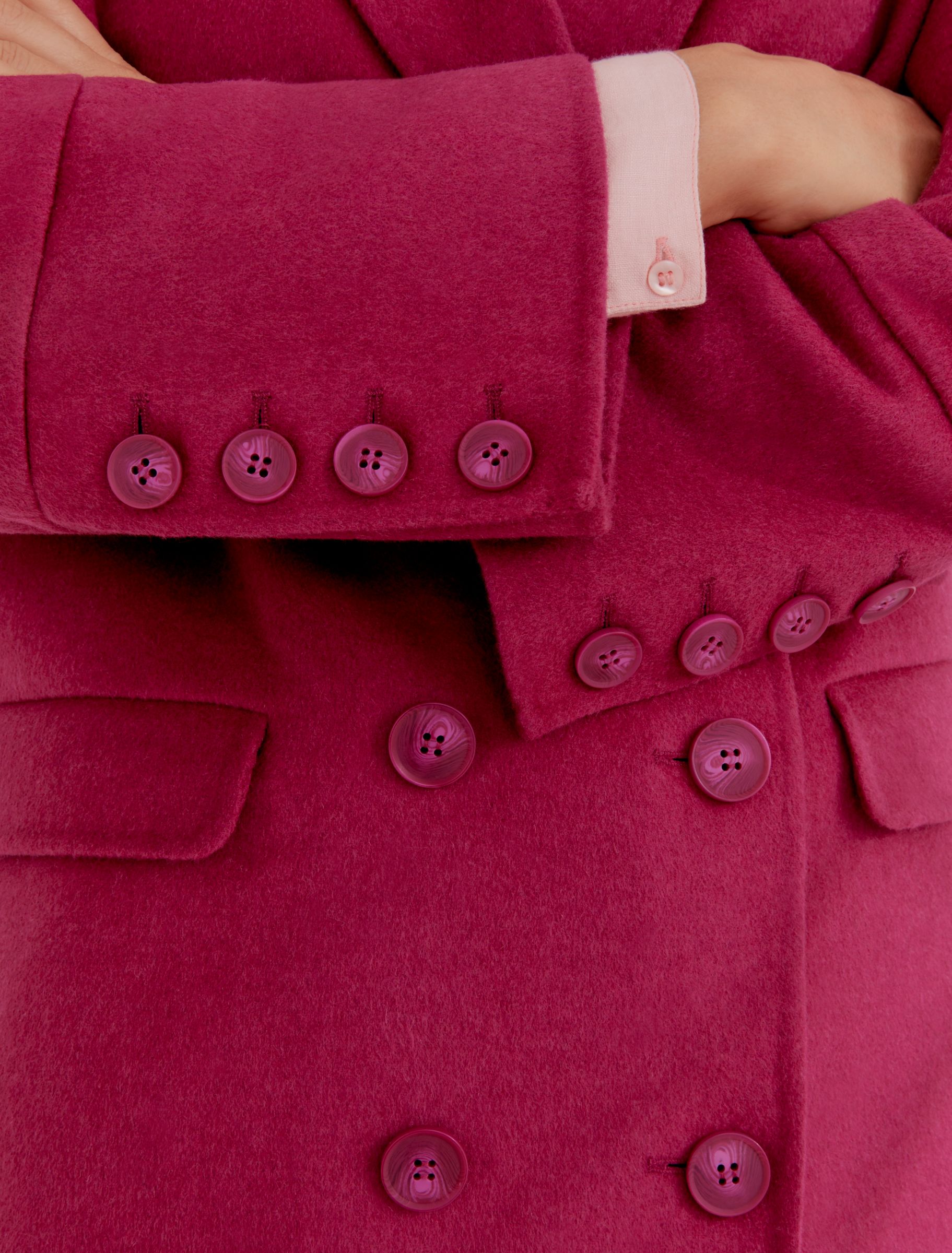 Woman wearing pink coat