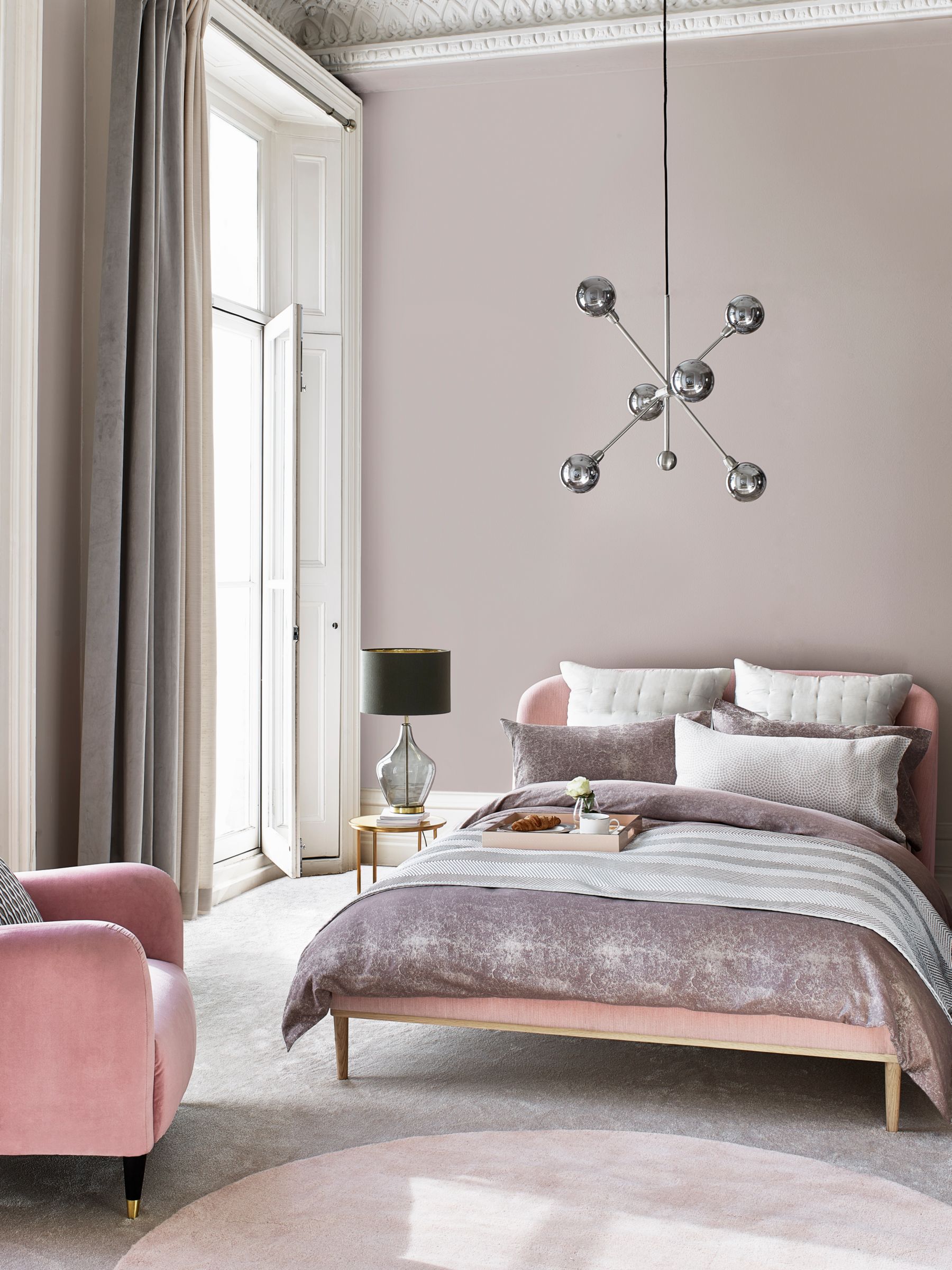 Pink bed and accent chair
