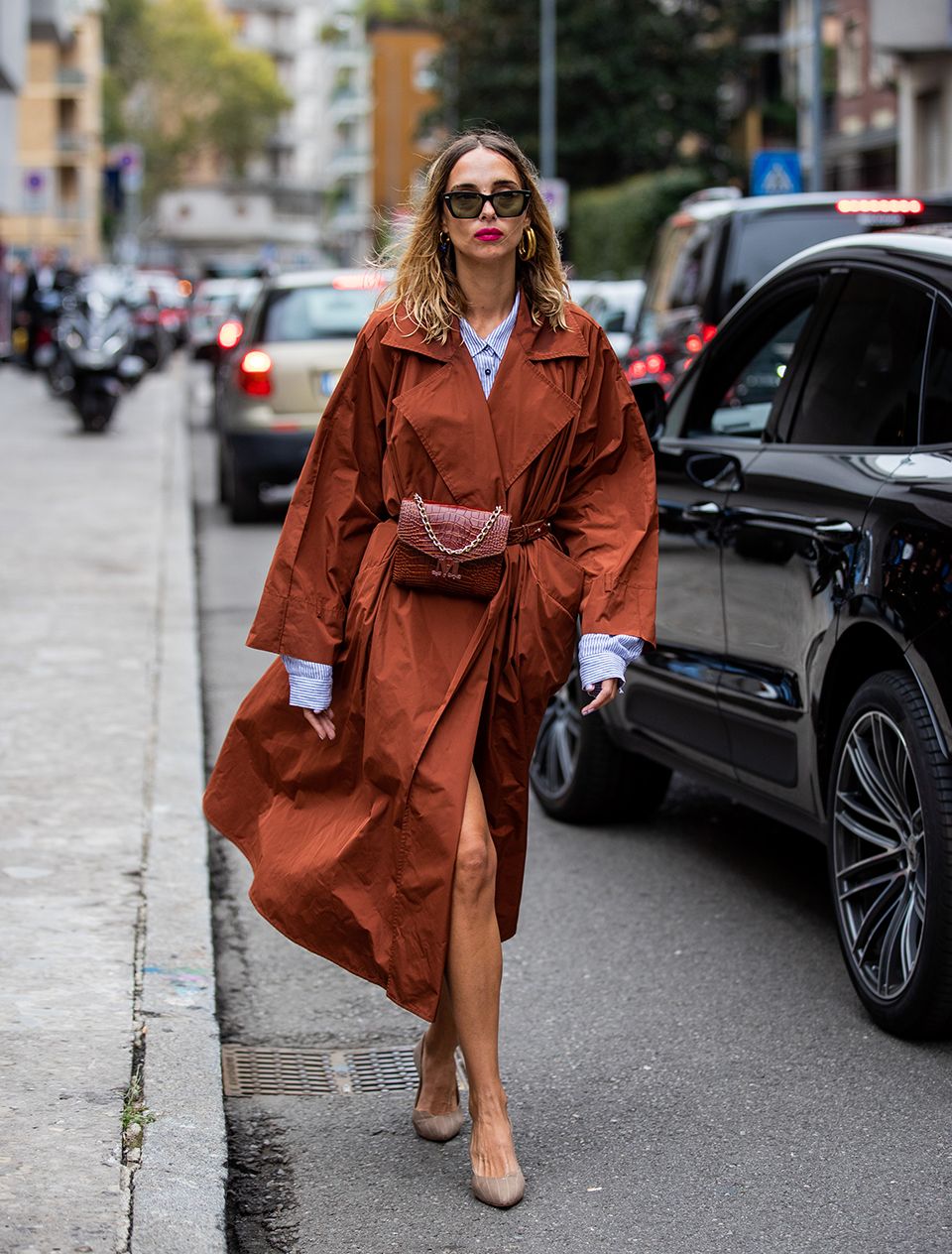 How to style a trench coat: swap a belt for a bum bag